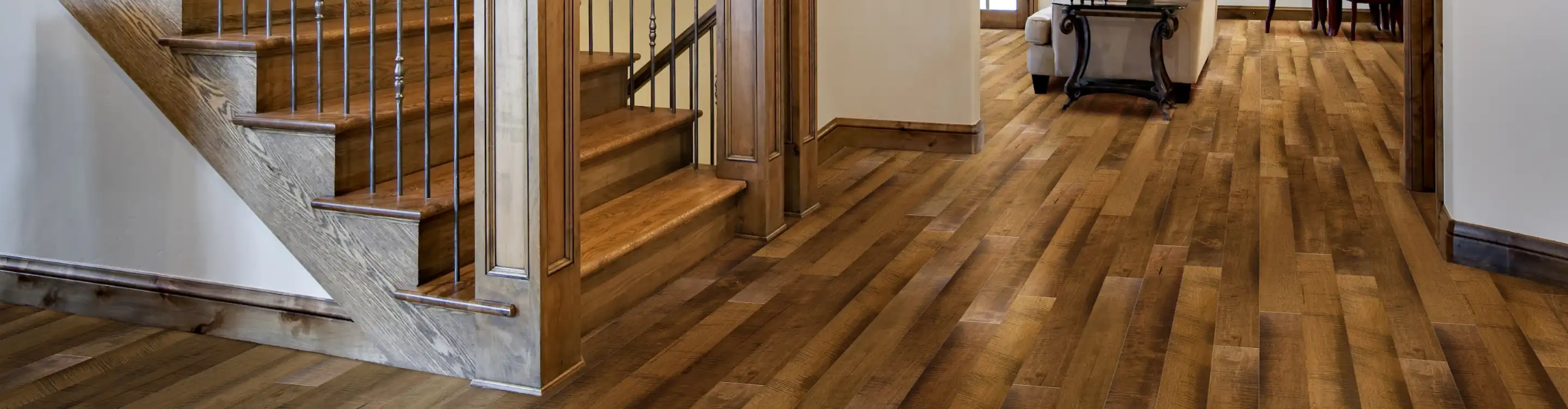 Hardwood flooring in entryway with stairs 